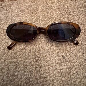 Le Specs Tortoise Oval Sunglasses with Dark Lenses